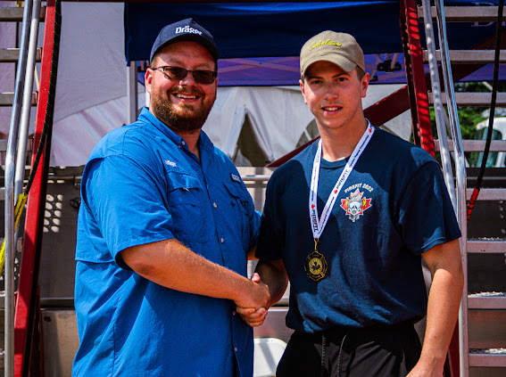 Receiving medal at FireFit Championships award ceremony